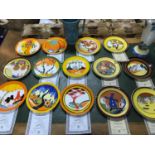 A Collection of 14 Wedgwood The Bizarre living landscape plates by Clarice Cliff. Together with a