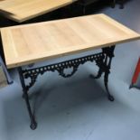 A Heavy cast iron base, solid light oak top table, Ideal for kitchen table. Measures 71x90x50cm