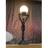 A Bronzed effect art deco lady table lamp. In a working condition.