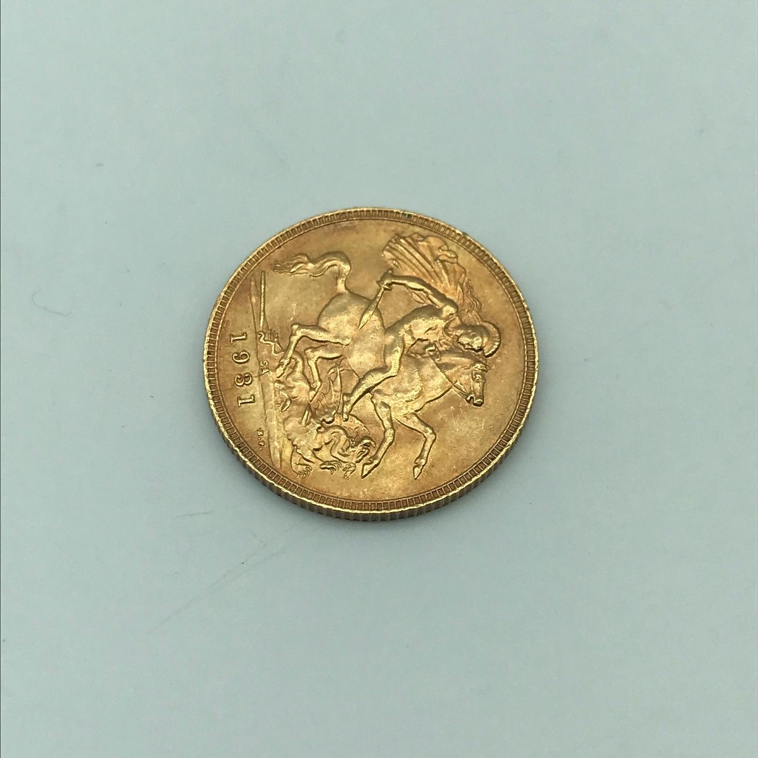 A Gold 1931 full sovereign coin. - Image 2 of 2