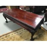 A Heavily carved wood reproduction lounge table or conservatory table. Measures 51.5x140x66.5cm