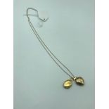 A 9ct gold chain together with two 9ct gold lockets. Total weight 3.91grams