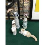 A Lot of four Lladro and Nao figurines. Includes Nao laying cat figure, Lladro lady with parasol,