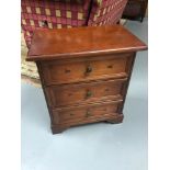 A Dark wood inlaid 3 drawer side chest, Measures 57x49x30
