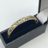 A Lovely and high quality 14ct gold ladies sapphire and diamond set bangle. Total Weight of diamonds