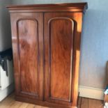 A Large Victorian double wardrobe fitted with interior drawers. Wardrobe comes in four pieces.