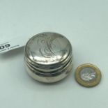 A Birmingham silver pill box, Engraved with initials E.O To the lid. Dated 1918 and made by Henry