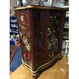 A Chinese red lacquered four drawer chest, detailed with hand painted birds and flowers designs.