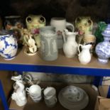 Two shelves of collectables to include Wedgwood German bear jugs & Goebel fish etc