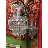 A Lot of two antique crystal drop let chandeliers together with three others and a lot of spare drop