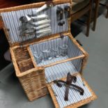 A wonderful example of a modern wicker picnic box with lined fabric (please note some of the items