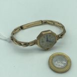 A Vintage 9ct gold cased and bracelet Ernest Borel Incastar ladies watch. In a working condition.