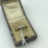 A Ladies 9ct gold ring set with three large clear stones. Ring size Q. Weighs 1.45grams