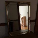 A Heavy German mirror with gilt framing. Measures 96x69cm