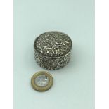 A Lovely example of a Birmingham silver pill box ornately designed with a swirl effect. Dated 1892.