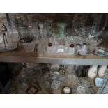 2 Shelves filled with crystal and glass, together with a gilt dressing table set