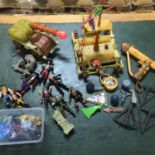 A collection of vintage Peter Pan toys which includes vehicles and a tub of knight on horse figures