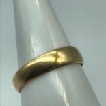 A Scottish Glasgow marked 18ct gold wedding band. Ring size P. Weighs 2.53grams