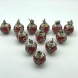 A Collection of 12 Zodiac white metal and red hard stone figures/ sculptures