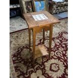 An Arts and crafts light oak plant stand table with fitted tile to the top.