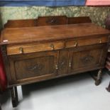 An Art Deco pedestal sideboard consisting of two drawers and two doors. Manufactured by Superoke.