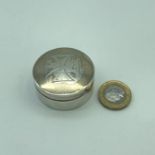 A London silver pill box, made by Blunt, Wray & Co. Dated 1893.