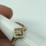 A 9ct gold ladies ring set with a diamond cluster. Ring size Q, Weighs 1.77grams