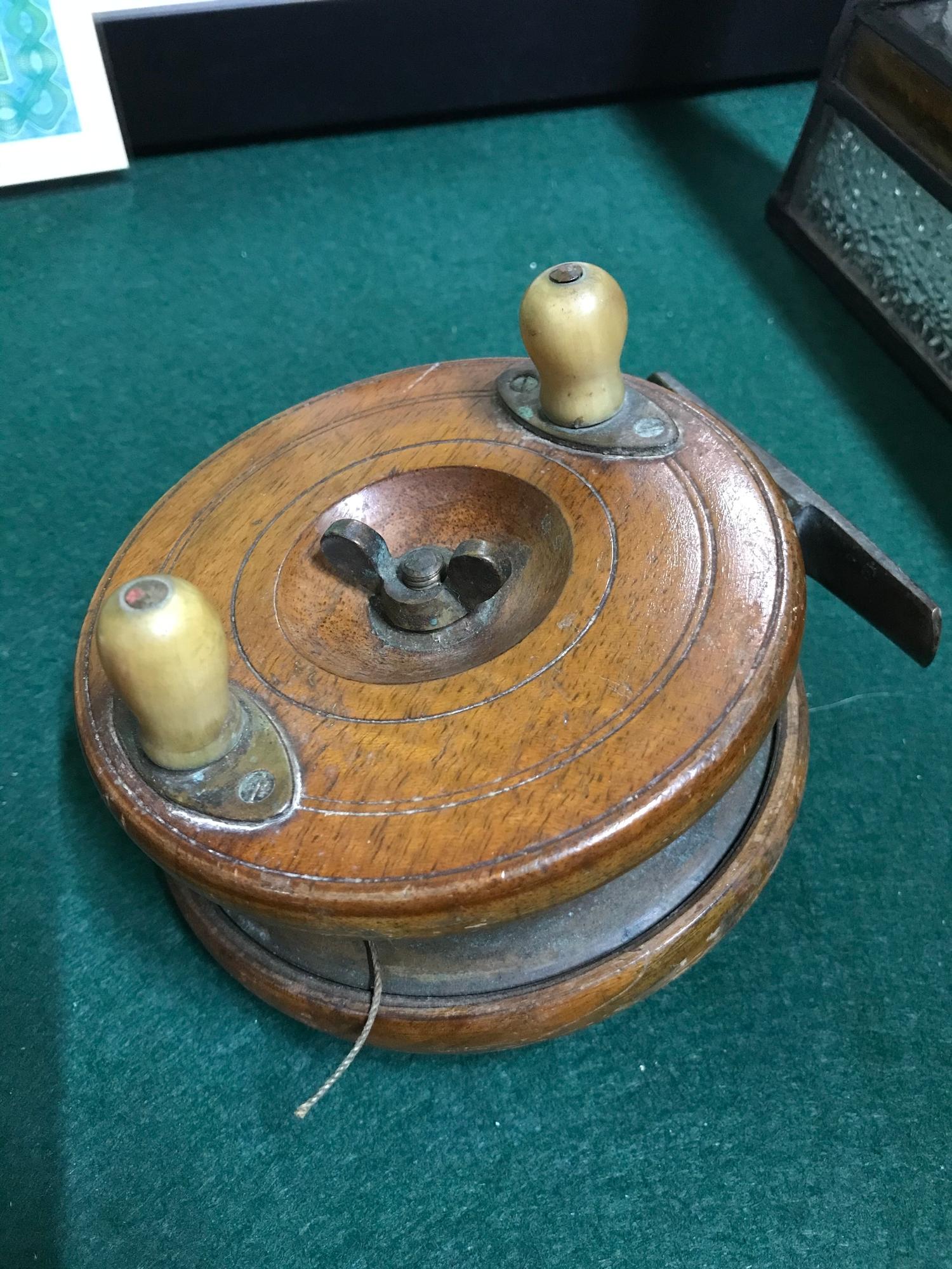 Antique wood brass and horn handle fly reel.