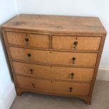 A Georgian two over three drawer light oak chest.