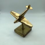 An Art Deco style Brass model of a WW2 Hurricane plane.