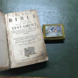 An old leather bound Holy Bible, together with an old trinket box with a printed panel