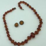 Antique amber graduating bead necklace, together with a Sterling 925 silver earrings set with amber.