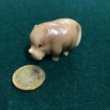 Antique Japanese hand carved netsuke of a baby rhino. Singed by the artist. 3x4x2.5cm