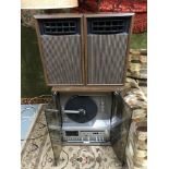 A Retro/ Vintage Mitsubishi MC-8000 Record/ Tape/ Stereo player with speakers. Switches on and