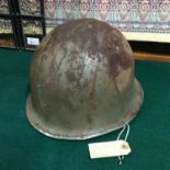 A WW2 Military Helmet possibly American, Retrieved from St Valery France.