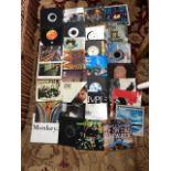 A Large Collection of single records to inclue Several Simple Minds, Eurythmics, Dire Straits and