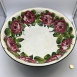A Large Wemyss Ware wash bowl, designed with cabbage rose design to the inside, on the reverse