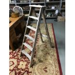 A Pair of vintage rustic style A Frame ladders.