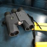 A Set of Bresser 8x42 waterproof binoculars with carry strap.
