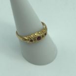 Antique Chester 18ct gold ring set with three ruby stones and two diamonds. Ring size Q, Weighs 2.