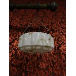 An Art Deco pink milk glass ceiling shade. with original chains.