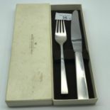 A Heavy Georg Jensen Sterling silver fork and Sterling silver handle knife. Comes with original