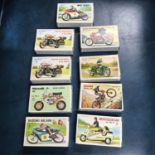 A Lot of vintage motorcycle model kits. 8 Checked one empty.