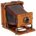 Folding-Bed Camera 13 x 18 cm, c. 1900Unmarked, plate size 5 x 7 in. (13 x 18 cm), polished walnut