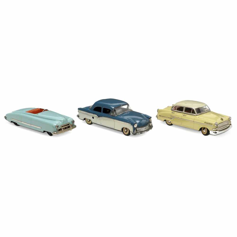 3 German Tin Toy Cars, 1950s1) Ford, Siegfried Günthermann, Nuremberg. Lacquered tin, spring-