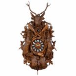 Large Black Forrest Cuckoo Clock, c. 1915In elaborate carved walnut case decorated with game (