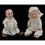 2 Bisque Character Babies, c. 1920s1) Possibly Nöckler & Tittel, Schneeberg, Germany. Incised "