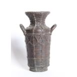 A Japanese vase with twin handles, with simulated basket weave decoration to the body and flared