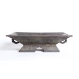 A Japanese bronze ceremonial tray with twin handles, the base of the top with character marks, the