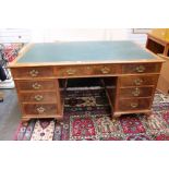 A George III style walnut pedestal desk with drawers on short cabriole legs, bearing plaque '108'